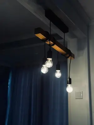a group of lights hanging from a ceiling at Apartment Casa Deluxe in Visoko