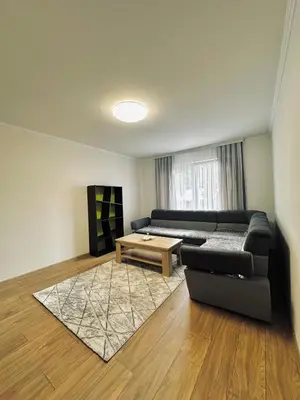 a living room with a couch and a coffee table at Apartment Casa Deluxe in Visoko