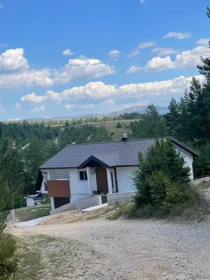 a house on a hill with a dirt road at Sašina kuća in Livno