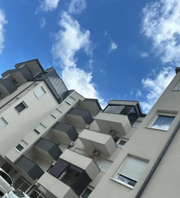 a building with balconies on the side of it at Apartment ALINA in Visoko