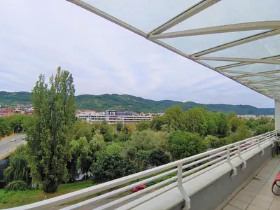 a view of a city from a balcony at Sunny River BL in Banja Luka