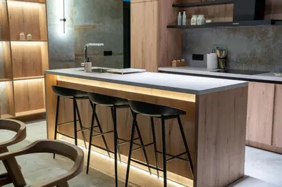 a kitchen with a counter with stools around it at Villa Alma Nova in Laktaši