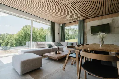 a living room with a couch and a table at Villa Alma Nova in Laktaši