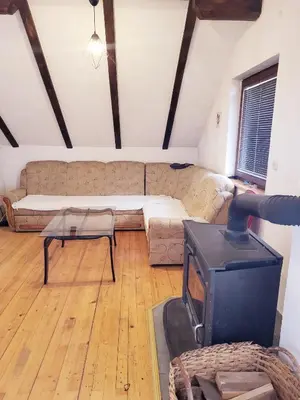 a living room with a couch and a tv at N&M Mountain Escape in Kupres