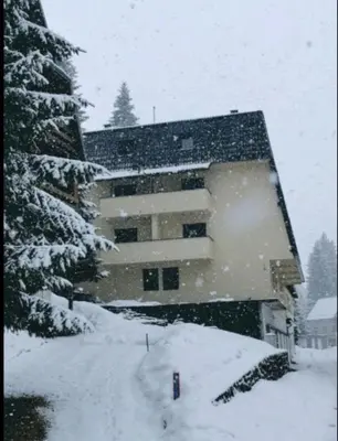 a large building in the snow in front thereof at Vlašić Vacation apartment in Vlasic