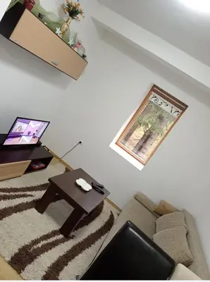 a living room with a couch and a table at Vlašić Vacation apartment in Vlasic