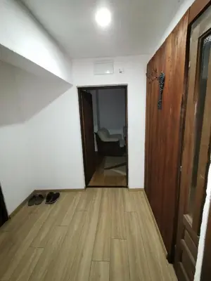 a hallway with a door and a room with a chair at Kuća na dan in Bosansko Grahovo