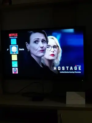 a television screen with a picture of a woman at Kuća na dan in Bosansko Grahovo