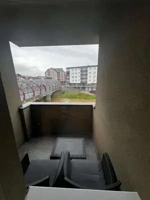 a view of a room with chairs and a window at Apartman Sara in Teslić