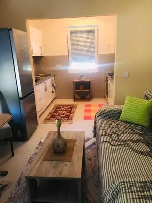 a living room with a couch and a table at Apartment Medi in Visoko
