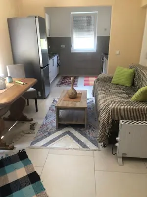 a living room with a couch and a table at Apartment Medi in Visoko