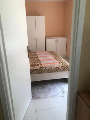 a small bedroom with a bed in a room at Apartment Medi in Visoko
