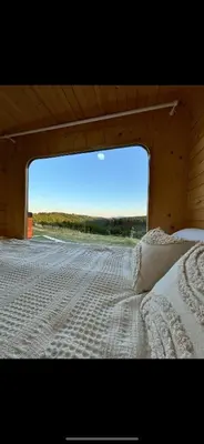 a bedroom with a bed with a view of a road at Petrovf Place