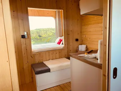 a small room with a window in a cabin at Petrovf Place