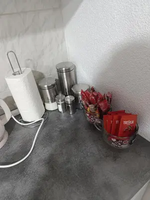 a counter top with two bowls of food on it at Apartman ARDA in Jajce
