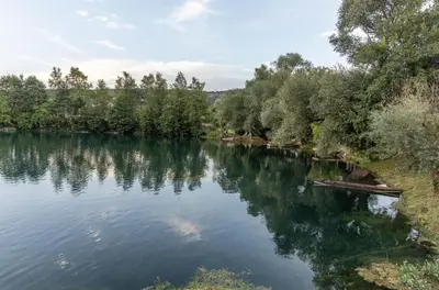 a river with trees on the side of it at Nessy Bihać in Bijelo Brdo