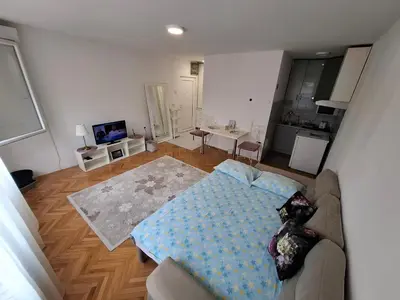 an aerial view of a living room with a couch at Apartman TEA in Ivišovo Greblje