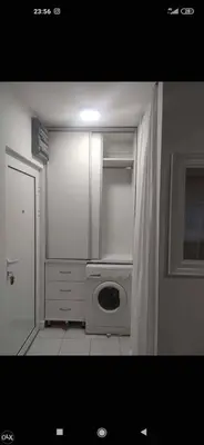 a washer and dryer in a kitchen with a window at Apartman TEA in Ivišovo Greblje