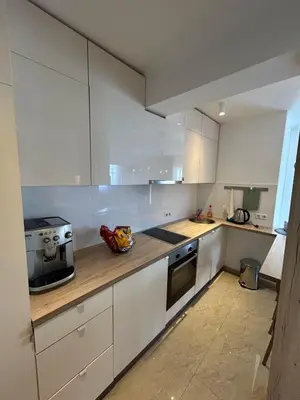 a kitchen with white cabinets and a counter top at Villa Laura in Gornji Vakuf