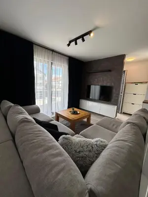 a living room with a couch and a television at Villa Laura in Gornji Vakuf