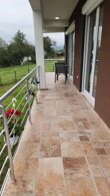 a porch with a bench on a house at Villa Zeleno Brdo in Visoko