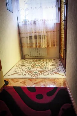 a room with a carpet on the floor next to a window at Apartment Red House in Visoko