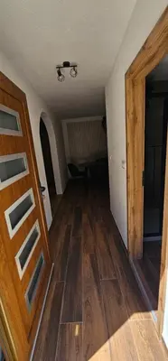 an empty room with a wooden floor and a door at Studio Šumska prica in Livno