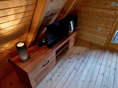 a living room with a flat screen tv in a cabin at Fikro's Resort in Kulen Vakuf