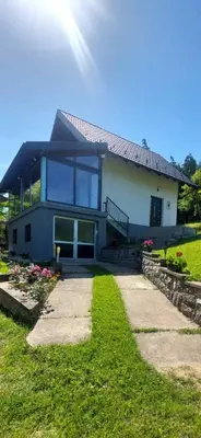 a house with a pathway leading to it at Vikendica Radoš