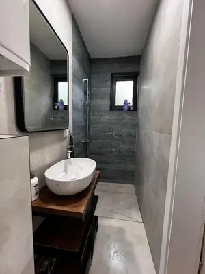 a bathroom with a sink and a mirror at Vikendica Radoš