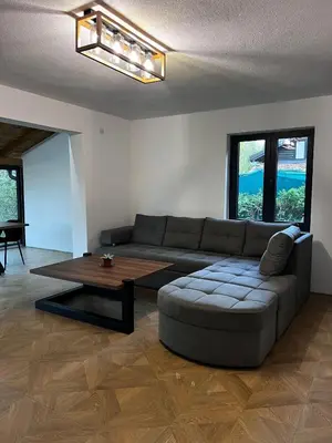 a living room with a couch and a coffee table at Vikendica Radoš