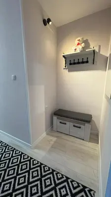 a room with a bench and a shelf on the wall at Moj dom Petrićevac in Banja Luka