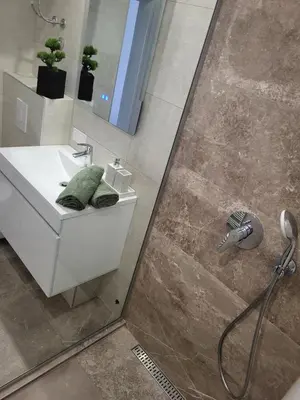 a bathroom with a sink and a shower at Friends 2 Vlašić in Vlasic
