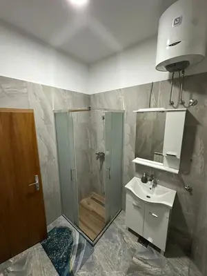 a bathroom with a shower and a sink at Apartmani Samardzic in Bosanska Gradiška
