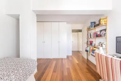 a bedroom with a bed and a book shelf at Kuća za odmor u Bosanskoj Krupi in Bosanska Krupa