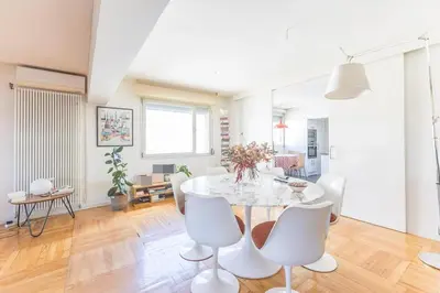 a white dining room with a white table and chairs at Kuća za odmor u Bosanskoj Krupi in Bosanska Krupa
