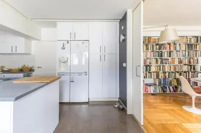 a kitchen with white cabinets and a white refrigerator at Kuća za odmor u Bosanskoj Krupi in Bosanska Krupa