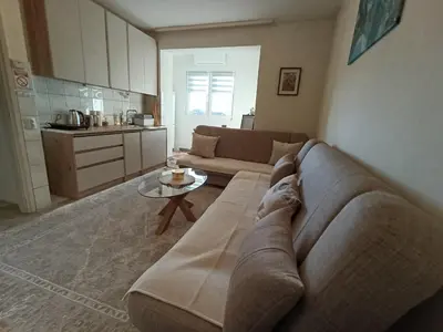 a living room with a couch and a table at Abrazo in Orašje