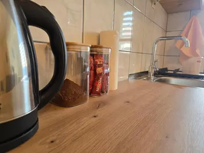 a kitchen counter with two cups of coffee on it at Abrazo in Orašje
