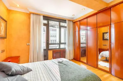 a bedroom with a bed and a large window at Moderan smještaj s parkingom Nova Bila in Nova Bila