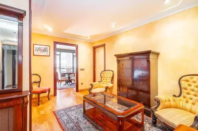 a living room with a coffee table and chairs at Moderan smještaj s parkingom Nova Bila in Nova Bila