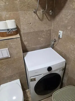 a small bathroom with a toilet and a sink at Terra Lux in Travnik