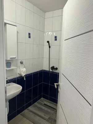 a bathroom with a sink and a toilet and a shower at Dvorac Kastel in Ljubače