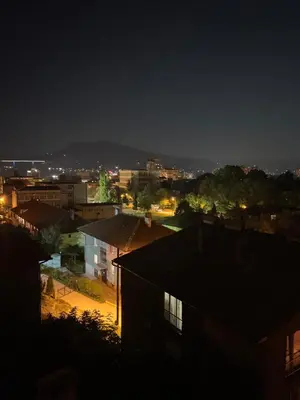 a view of a city at night at Apartman Rejjan in Zenica