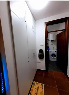a room with a bathroom with a toilet and white cabinets at AnyBL02 in Hiseti