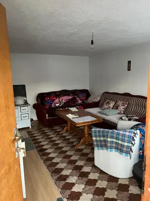 a living room with a couch and a table at Kućica za odmor in Maglaj