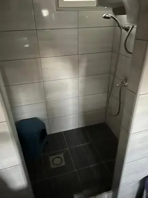 a bathroom with a shower stall with a toilet at Kućica za odmor in Maglaj