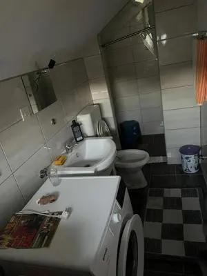 a bathroom with a sink and a toilet and a tub at Kućica za odmor in Maglaj