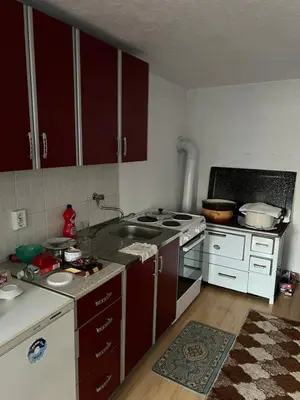 a kitchen with a sink and a stove top oven at Kućica za odmor in Maglaj