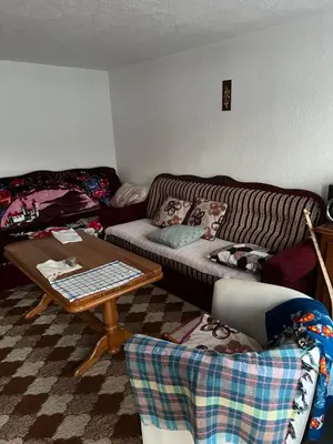a living room with a couch and a table at Kućica za odmor in Maglaj